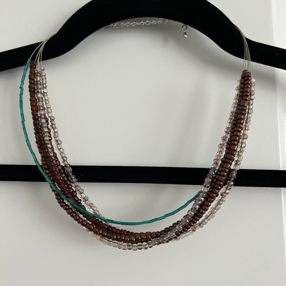 Layered bead necklace browns/clear/turquoise